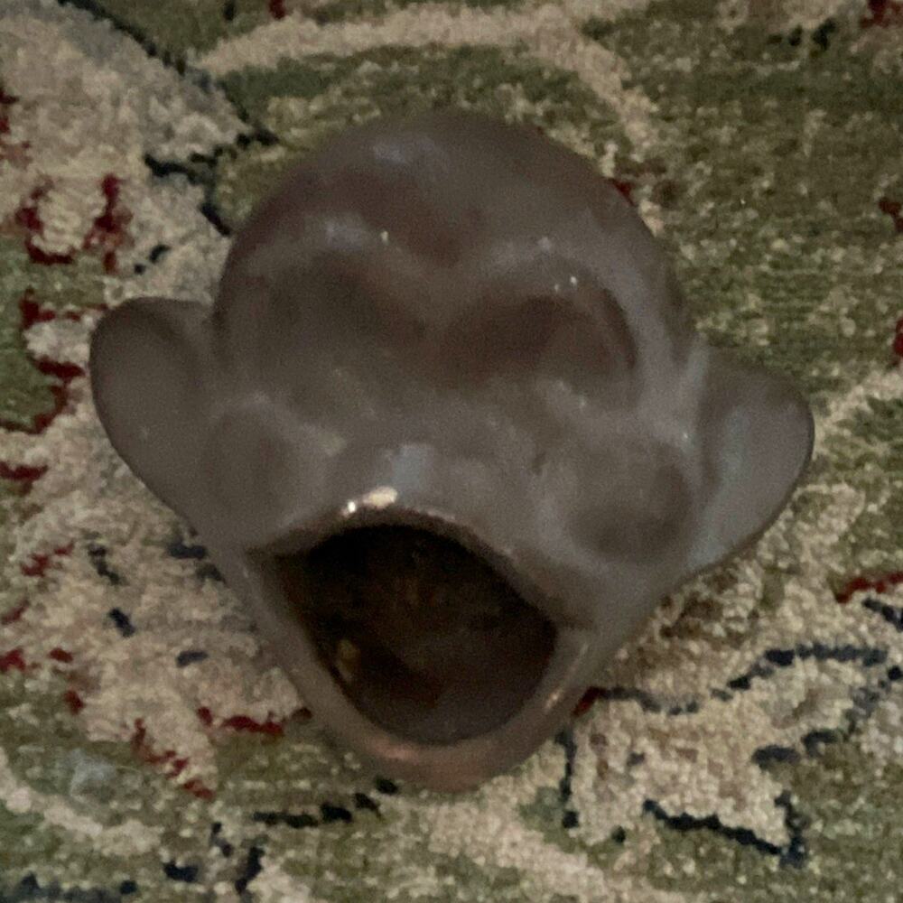 open-mouth ceramic monkey/chimpanzee head, typically used as a novelty ashtray